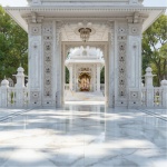 Temple inlay expert showcasing semi precious stone marble inlay work on temple entrance pillar