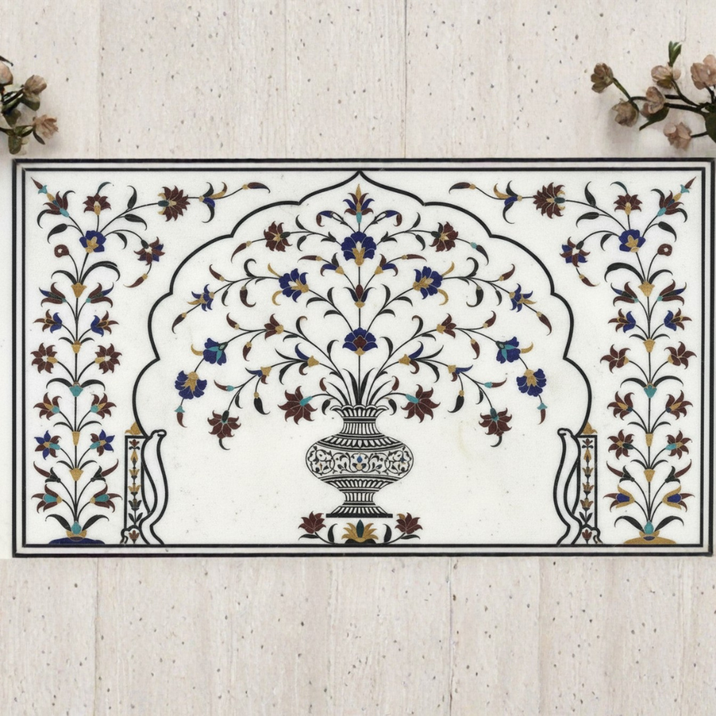 Temple inlay expert showcasing handcrafted floral marble inlay with semi precious stones on Makrana white marble